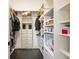 Spacious walk-in closet featuring custom shelving and ample storage space for clothes, shoes, and accessories at 152 Riggings Way, Clermont, FL 34711