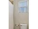 Bright bathroom featuring a window with blinds and a white shower curtain at 15769 Shorebird Ln, Winter Garden, FL 34787