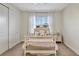 Comfortable bedroom featuring a bed, bedside table and plenty of natural light from a window at 15769 Shorebird Ln, Winter Garden, FL 34787