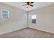 Bright bedroom with carpeted floors, a ceiling fan, and multiple windows allowing for plenty of natural light at 15769 Shorebird Ln, Winter Garden, FL 34787