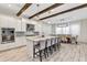 Open kitchen boasts a large island, white cabinetry, and stainless steel appliances at 15769 Shorebird Ln, Winter Garden, FL 34787