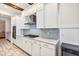 Kitchen boasts stainless steel appliances, granite countertops, and custom white cabinets at 15769 Shorebird Ln, Winter Garden, FL 34787