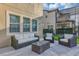 Inviting outdoor living space with comfortable seating and a glass-top coffee table at 15769 Shorebird Ln, Winter Garden, FL 34787