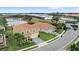 An aerial view features this two-story home, enhanced by a lush lawn and an attractive brick driveway at 1640 Oak Blossom Dr, Davenport, FL 33837
