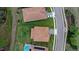 Aerial view of the fenced-in backyard featuring a playset and direct view looking over the neighboring streets at 1640 Oak Blossom Dr, Davenport, FL 33837
