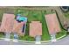 This eye-level image showcases a home equipped with a pool and solar panels, emphasizing its sustainable energy solutions at 1640 Oak Blossom Dr, Davenport, FL 33837