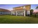The backyard is complete with a screened-in porch, providing an ideal space for enjoying the outdoors while protected from pests at 1640 Oak Blossom Dr, Davenport, FL 33837