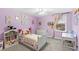 Bedroom with a purple wall, white furniture, and a ceiling fan at 1640 Oak Blossom Dr, Davenport, FL 33837
