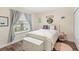 Cozy secondary bedroom featuring wood floors and lots of natural light at 1640 Oak Blossom Dr, Davenport, FL 33837