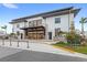 Modern two-story building featuring large windows, a covered entrance, and sleek architectural design at 1640 Oak Blossom Dr, Davenport, FL 33837