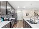 Updated kitchen with stainless steel appliances, granite countertops, and ample cabinet space at 1640 Oak Blossom Dr, Davenport, FL 33837