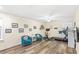 Bright living room with hardwood floors and a home gym setup at 1640 Oak Blossom Dr, Davenport, FL 33837