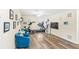Bright living room with hardwood floors and a home gym setup at 1640 Oak Blossom Dr, Davenport, FL 33837