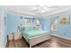 Bright main bedroom boasts wood floors and lots of natural light at 1640 Oak Blossom Dr, Davenport, FL 33837
