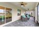 Covered patio with outdoor seating overlooking backyard at 1640 Oak Blossom Dr, Davenport, FL 33837