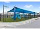Community playground with blue shade structure, slides, and climbing equipment, perfect for fun at 1640 Oak Blossom Dr, Davenport, FL 33837