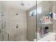 Spacious tile shower with glass partition and built-in shelving at 1640 Oak Blossom Dr, Davenport, FL 33837