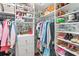 Custom walk-in closet with shelving and rods for ample storage at 1640 Oak Blossom Dr, Davenport, FL 33837