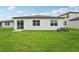 Large backyard with well-maintained lawn offers plenty of space for entertaining at 2089 Rosewood Dr, Bartow, FL 33830