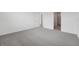 Spacious bedroom with neutral carpeting, white walls, and adjacent closets, offering a comfortable retreat at 2089 Rosewood Dr, Bartow, FL 33830