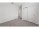 This carpeted bedroom offers a large closet for ample storage space at 2089 Rosewood Dr, Bartow, FL 33830