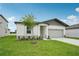 A single-story home features a well-manicured lawn and welcoming curb appeal at 2089 Rosewood Dr, Bartow, FL 33830