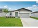 Charming single-story home with a well-manicured lawn and inviting curb appeal at 2089 Rosewood Dr, Bartow, FL 33830