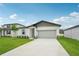 Charming single-story home with a well-manicured lawn and a two-car garage, offering a welcoming curb appeal at 2089 Rosewood Dr, Bartow, FL 33830