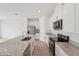 Modern kitchen featuring granite countertops, stainless steel appliances, and white cabinets at 2089 Rosewood Dr, Bartow, FL 33830