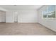 Spacious living room with tile floors, and a large window offering great natural light at 2089 Rosewood Dr, Bartow, FL 33830