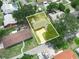 An aerial view highlights the home's location within a lush, established neighborhood at 228 Kilmer Ln, Winter Haven, FL 33884