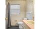 Bathroom featuring tiled walls, a toilet, and vanity with a bright pink countertop at 228 Kilmer Ln, Winter Haven, FL 33884