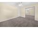 Bedroom featuring neutral carpet, mirrored closet, ceiling fan, and a large window at 228 Kilmer Ln, Winter Haven, FL 33884