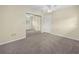 Bedroom featuring neutral carpet, mirrored closet, and ceiling fan at 228 Kilmer Ln, Winter Haven, FL 33884