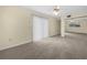 Bedroom with neutral carpet, sliding glass door to the patio and a ceiling fan at 228 Kilmer Ln, Winter Haven, FL 33884
