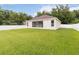 Wide view of a sprawling green backyard features a white fence and the back of the home at 2280 Yorville Ct, Ocoee, FL 34761