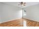 Bright bedroom features hardwood floors, a ceiling fan, and a window for natural light at 2280 Yorville Ct, Ocoee, FL 34761