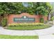 Brick sign for the Remington Oaks community surrounded by manicured landscaping at 2280 Yorville Ct, Ocoee, FL 34761
