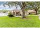 Well-maintained single-story home with lush green lawn and mature shade trees at 2280 Yorville Ct, Ocoee, FL 34761