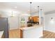 Kitchen area features a breakfast bar, stainless steel appliances, and neutral finishes at 2280 Yorville Ct, Ocoee, FL 34761