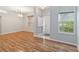 Spacious living room with wood floors, large windows, and a bright entryway at 2280 Yorville Ct, Ocoee, FL 34761