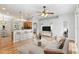 Open-concept living room with modern lighting, kitchen bar, and comfortable seating at 2280 Yorville Ct, Ocoee, FL 34761