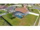 From above: Home with screened pool, large lawn, and a white perimeter fence at 2406 Placid Way, Kissimmee, FL 34758