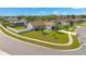 A high angle view of a single Gathering residence with large manicured lawn, perimeter fence and mature trees at 2406 Placid Way, Kissimmee, FL 34758