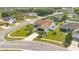 Elevated perspective showing the house and the generous corner lot with its manicured front and side lawns at 2406 Placid Way, Kissimmee, FL 34758