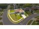 Aerial view of a well-manicured property with a white perimeter fence and established landscaping at 2406 Placid Way, Kissimmee, FL 34758