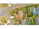 An aerial view showcasing the home, its large backyard, and a screened-in pool area at 2406 Placid Way, Kissimmee, FL 34758