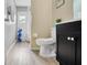 Bright bathroom featuring modern fixtures, a toilet, and a walk-in shower at 2406 Placid Way, Kissimmee, FL 34758