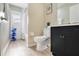 Bright bathroom featuring modern fixtures, a toilet, and a walk-in shower at 2406 Placid Way, Kissimmee, FL 34758