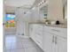 Bright bathroom featuring a glass shower, double sink vanity, granite countertops, and modern fixtures at 2406 Placid Way, Kissimmee, FL 34758